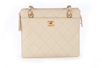 Lot 209 - A Chanel quilted cream leather handbag, 1990s,...