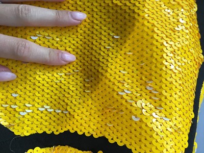 Lot 233 - A Chanel by Karl Lagerfeld yellow sequined 'Scuba' jacket, Spring-Summer 1991