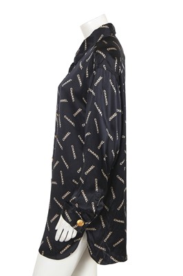Lot 238 - A Chanel by Karl Lagerfeld printed silk blouse and matching gilt cufflinks, circa 1988