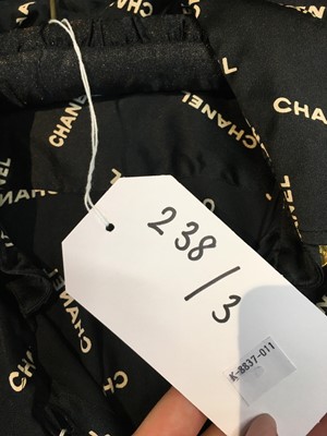 Lot 238 - A Chanel by Karl Lagerfeld printed silk blouse and matching gilt cufflinks, circa 1988