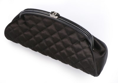 Lot 313 - A Chanel quilted black satin clutch bag,...