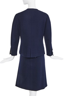 Lot 58 - A Chanel haute couture navy blue jersey suit, circa 1973