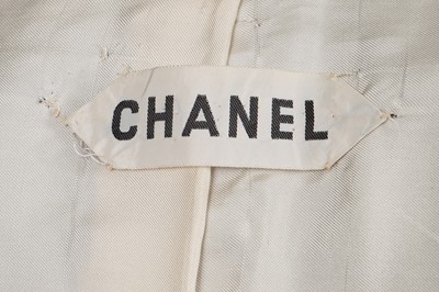 Lot 58 - A Chanel haute couture navy blue jersey suit, circa 1973