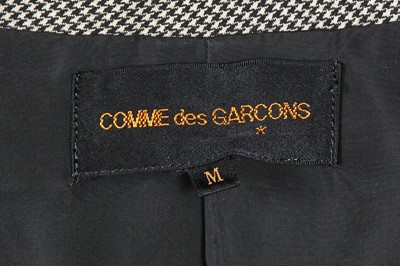 Lot 437 - A Comme des Garçons grey houndstooth wool jacket, 'Liberation from Tailoring' collection, Autumn-Winter 1989-1990