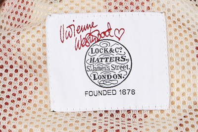 Lot 346 - A Vivienne Westwood ecru and red Harvard striped kitchen towel ensemble, circa 2005