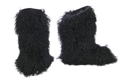 Lot 104 - A pair of Saint Laurent by Anthony Vaccarello black Mongolian sheepskin fur boots, circa 2019