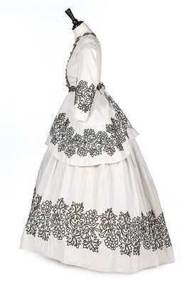 Lot 406 - A white matelasse cotton summer gown with...