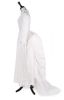 Lot 404 - A whiteworked muslin peignoir, late 1870s,...