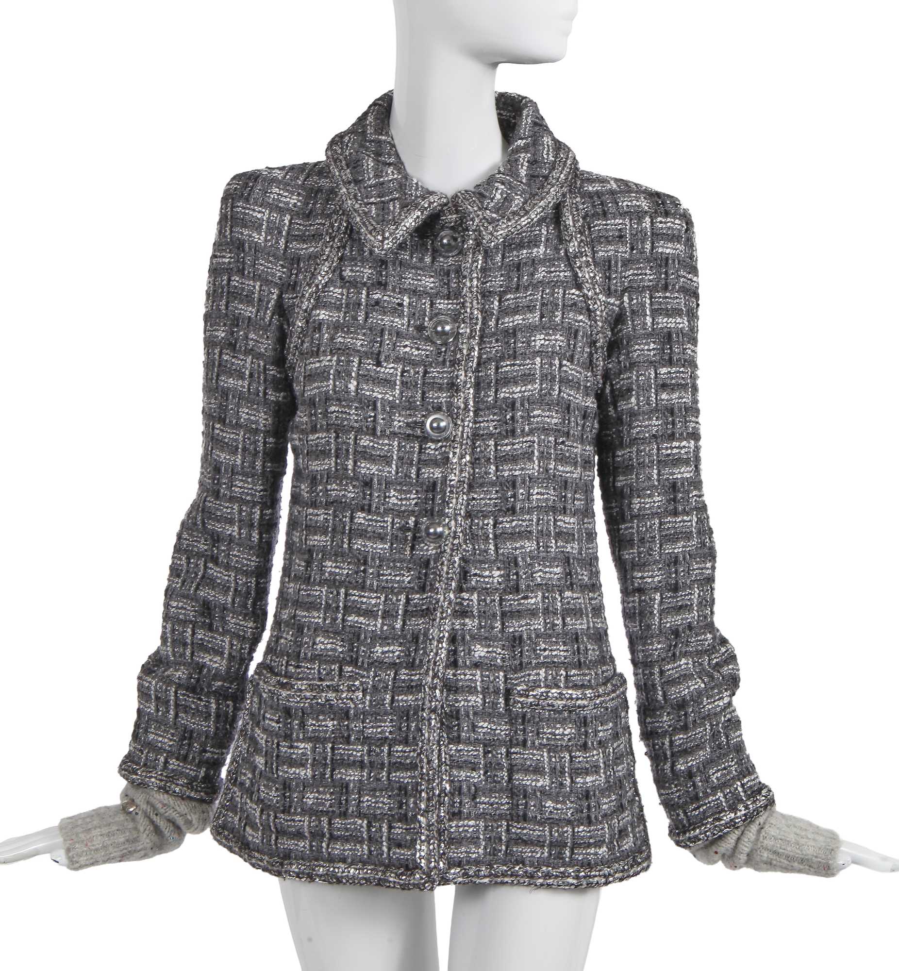 Lot 8 - A Chanel by Karl Lagerfeld grey tweed jacket, 'Chanel Airspace' collection, Autumn-Winter 2017-18