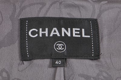Lot 8 - A Chanel by Karl Lagerfeld grey tweed jacket, 'Chanel Airspace' collection, Autumn-Winter 2017-18