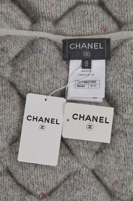 Lot 6 - A Chanel by Karl Lagerfeld pastel tweed jacket and pink cape, 'Chanel Airspace' collection, Autumn-Winter 2017-18