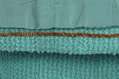 Lot 37 - A Chanel by Karl Lagerfeld turquoise cotton-wool blend bouclé suit, Spring-Summer 1994