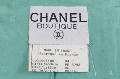 Lot 37 - A Chanel by Karl Lagerfeld turquoise cotton-wool blend bouclé suit, Spring-Summer 1994