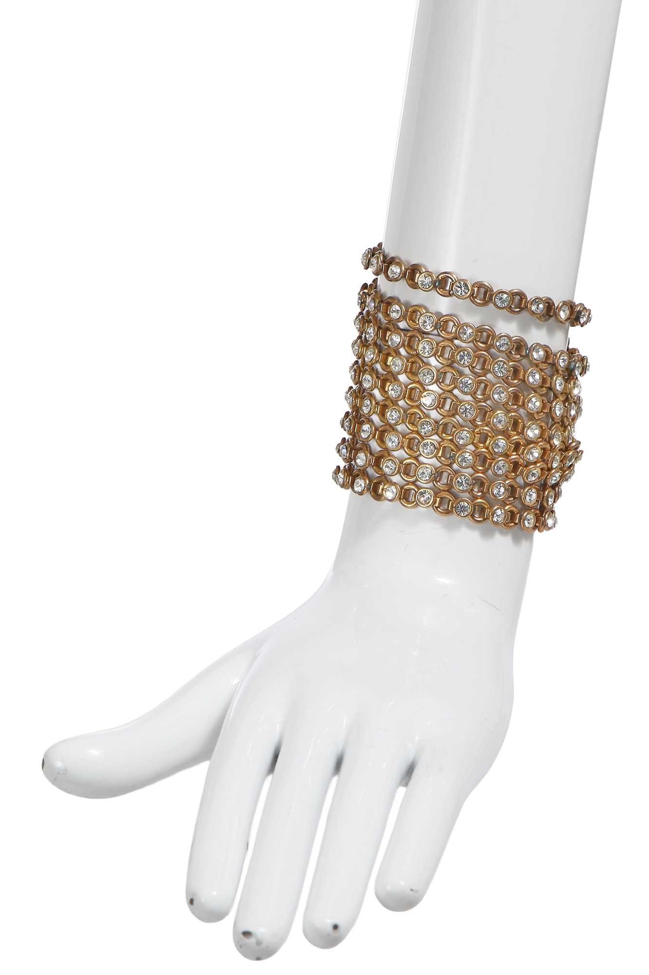 Lot 66 - A Gabrielle Chanel haute couture brass and rhinestone bracelet, 1970s