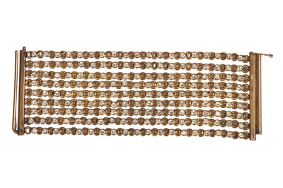 Lot 66 - A Gabrielle Chanel haute couture brass and rhinestone bracelet, 1970s