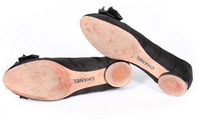 Lot 128 - A pair of Chanel black satin ballet pumps,...