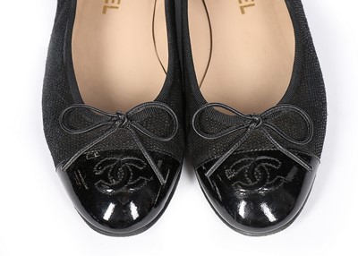 Lot 129 - A pair of Chanel black rubberised cotton...