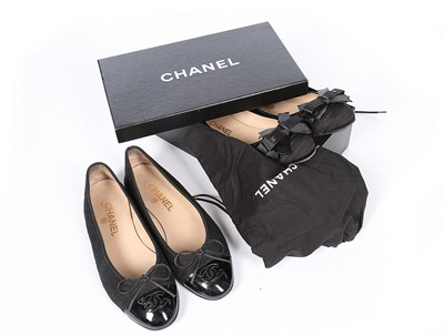 Lot 129 - A pair of Chanel black rubberised cotton...