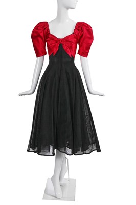 Lot 382 - An Yves Saint Laurent haute couture fuchsia satin and black mesh evening gown, Autumn-Winter, 1982