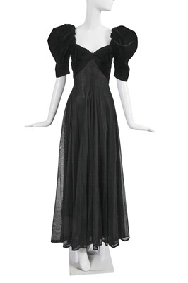 Lot 381 - An Yves Saint Laurent haute couture black mesh and velvet evening gown, circa 1983