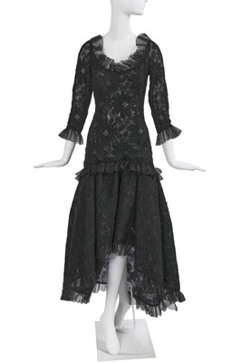 Lot 384 - An Yves Saint Laurent haute couture black guipure evening gown, early 1980s