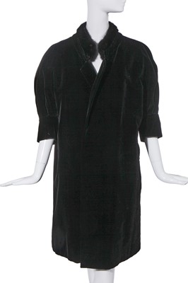 Lot 492 - A Christian Dior haute couture black velvet evening coat, 'Fuseau line', Autumn-Winter 1957-58