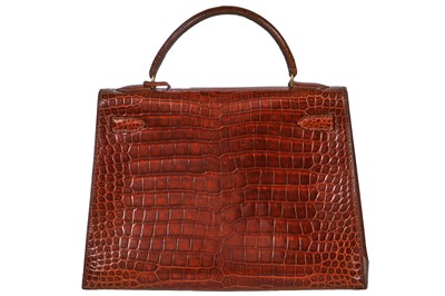 Lot 93 - An Hermès Miel Crocodile Kelly 32, 1988