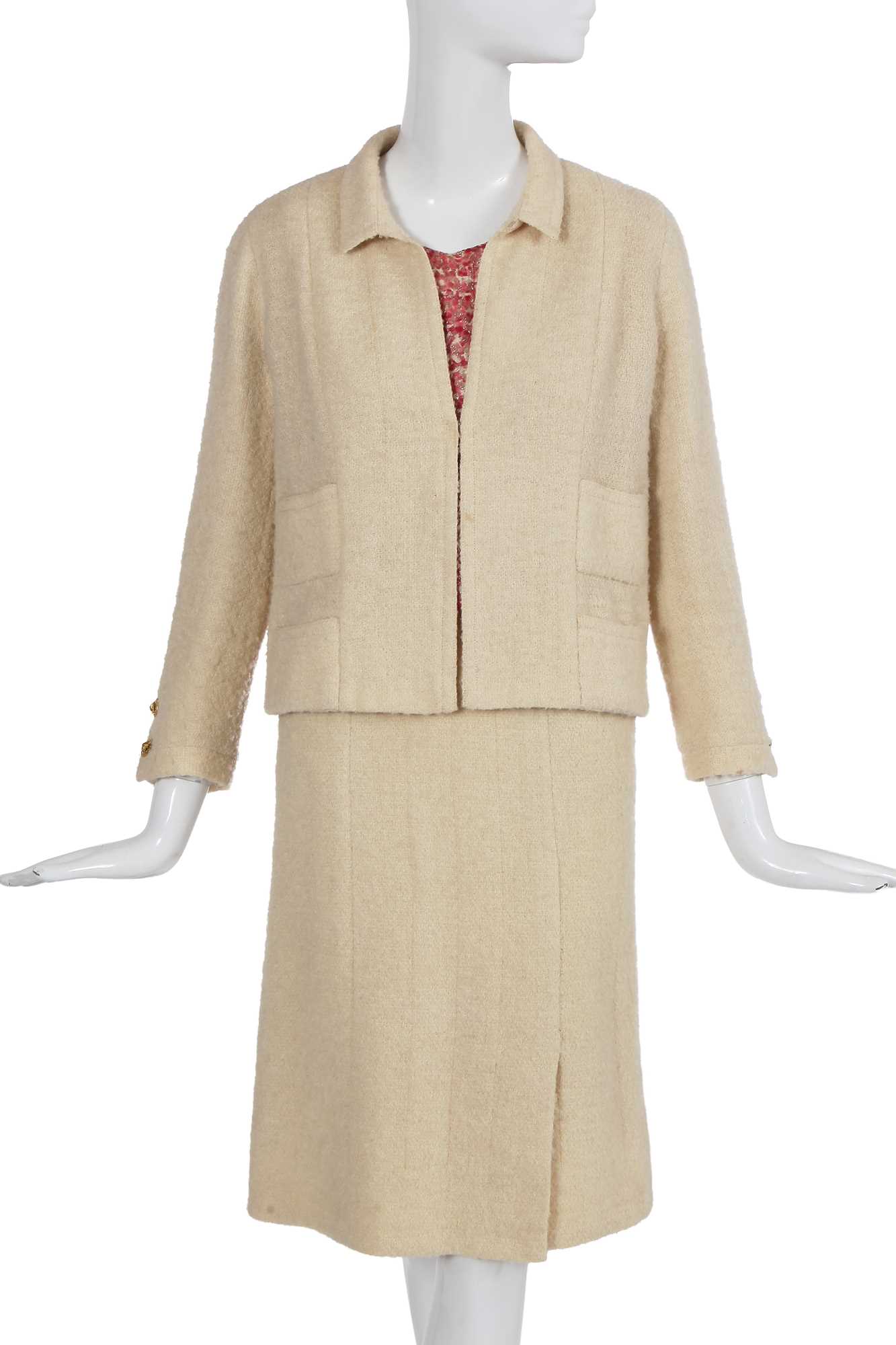Lot 64 - A Gabrielle Chanel haute couture cream bouclé suit, late 1960s