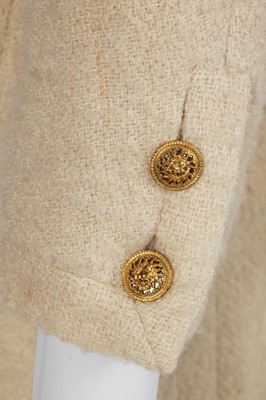 Lot 64 - A Gabrielle Chanel haute couture cream bouclé suit, late 1960s