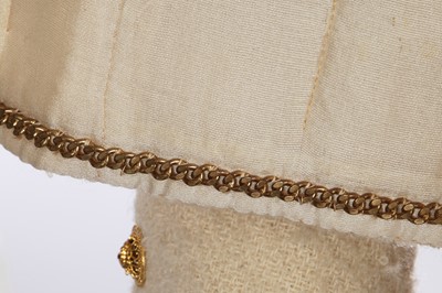 Lot 64 - A Gabrielle Chanel haute couture cream bouclé suit, late 1960s