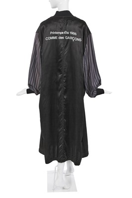Lot 200 - A Comme des Garçons black satin staff coat, 'Bias Cutting' collection Spring-Summer 1986