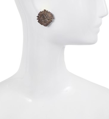 Lot 81 - A pair of Madame Grès by Robert Goossens silver-tone lion mask earrings, circa 1960