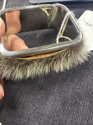 Lot 82 - A pair of Madame Grès metal and fur cuffs, 1960s