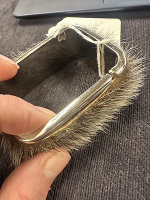 Lot 82 - A pair of Madame Grès metal and fur cuffs, 1960s