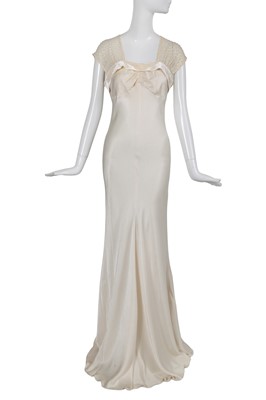 Lot 169 - A John Galliano ivory crêpe evening gown, 'Welcome to our Playground' collection, Autumn-Winter 2000-01