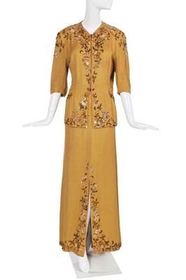 Lot 468 - Adelaide Hall's embellished mustard-yellow crêpe ensemble, 1944