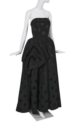 Lot 401 - A Pierre Balmain haute couture black polka-dot damask silk evening gown, 1980s