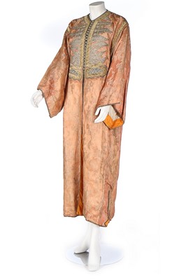 Lot 455 - A brocaded peach satin robe, Moroccan, early...