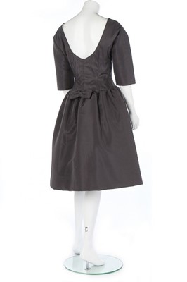 Lot 197 - A Givenchy couture black silk dinner dress and...