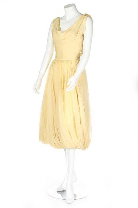 Lot 211 - A Maggy Rouff couture primrose chiffon