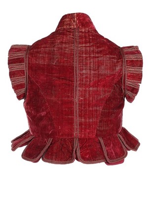 Lot 101 - A rare crimson velvet jerkin, circa 1610-25,...