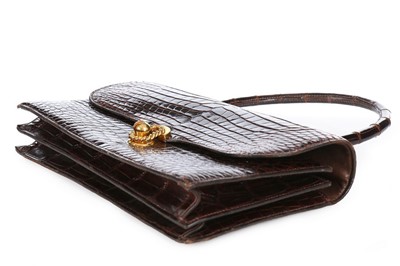 Lot 27 - An Hermès chocolate brown crocodile handbag,...