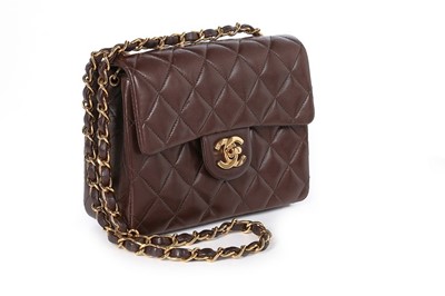 Lot 24 - A Chanel quilted brown leather bag, 1990s,...