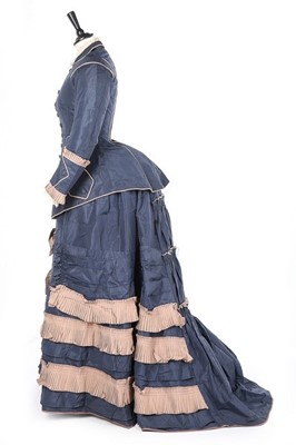 Lot 136 - A bi-colour silk faille gown, late 1870s, the...