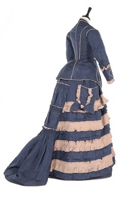 Lot 136 - A bi-colour silk faille gown, late 1870s, the...