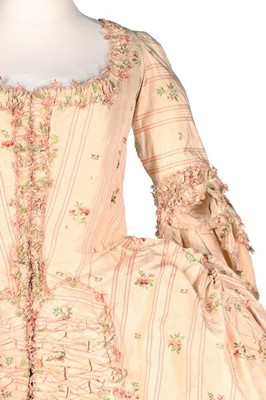 Lot 116 - A striped and floral brocaded pink silk robe à...