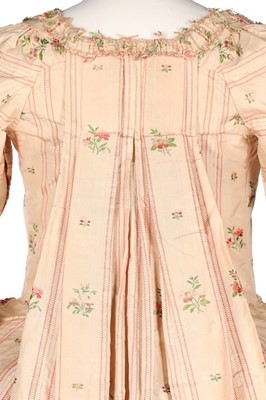 Lot 116 - A striped and floral brocaded pink silk robe à...