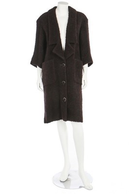 Lot 76 - A Chanel red and black bouclé coat, modern,...