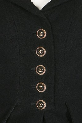 Lot 77 - A Chanel black bouclé wool ensemble, 2007,...