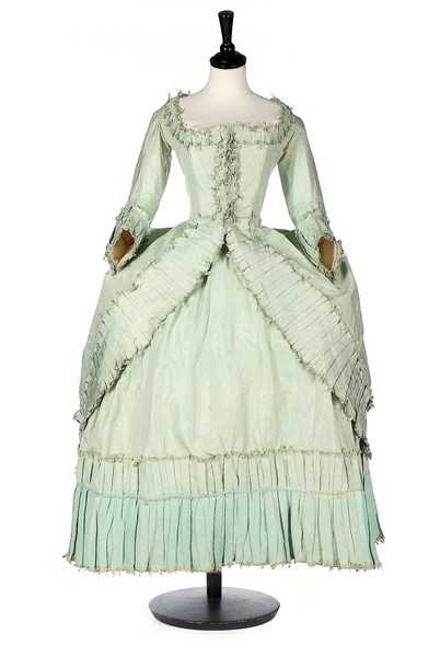 Click for high resolution Lot 102 - A peppermint-green silk 'Circassienne' robe,...